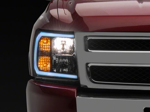 Raxiom 07-13 Chevrolet Silverado 1500 Axial Series Headlights w/ LED Bar- Black Housing (Clear Lens)
