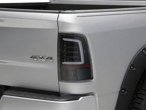 Raxiom 09-18 Dodge RAM 1500 Axial Series LED Tail Lights- Black Housing- Clear Lens