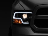 Raxiom 09-18 RAM 1500 LED Halo Projector Headlights- Black Housing (Clear Lens) thumbnail 1