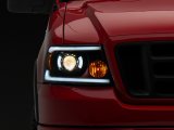 Raxiom 04-08 Ford F-150 Axial Series Projector Headlights w/ SEQL LED Bar- Blk Housing (Clear Lens) thumbnail 1
