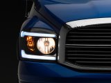 Raxiom 06-09 Dodge RAM 1500/2500/3500 Axial Headlights w/ SEQL LED Bar- Black Housing (Clear Lens) thumbnail 1