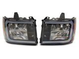 Raxiom 07-13 GMC Sierra 1500 Axial Series Headlights w/ LED Bar- Black Housing (Clear Lens) thumbnail 1
