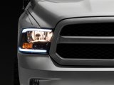 Raxiom 09-18 Dodge RAM 1500/2500/3500 Axial Series Headlights w/ LED Bar- Black Housing (Clear Lens) thumbnail 1