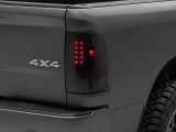 Raxiom 09-18 Dodge RAM 1500/2500/3500 Axial Series LED Tail Lights- Black Housing- Smoked Lens thumbnail 1