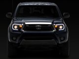 Raxiom 12-15 Toyota Tacoma Axial Projector Headlights w/ SEQL LED Bar- Black Housing (Clear Lens) thumbnail 8