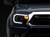 Raxiom 12-15 Toyota Tacoma Axial Series Projector Headlights w/ LED Bar- Black Housing (Clear Lens) thumbnail 3