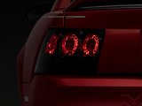 Raxiom 99-04 Ford Mustang Axial Series Altezza Style Tail Lights- Black Housing (Smoked Lens) thumbnail 1