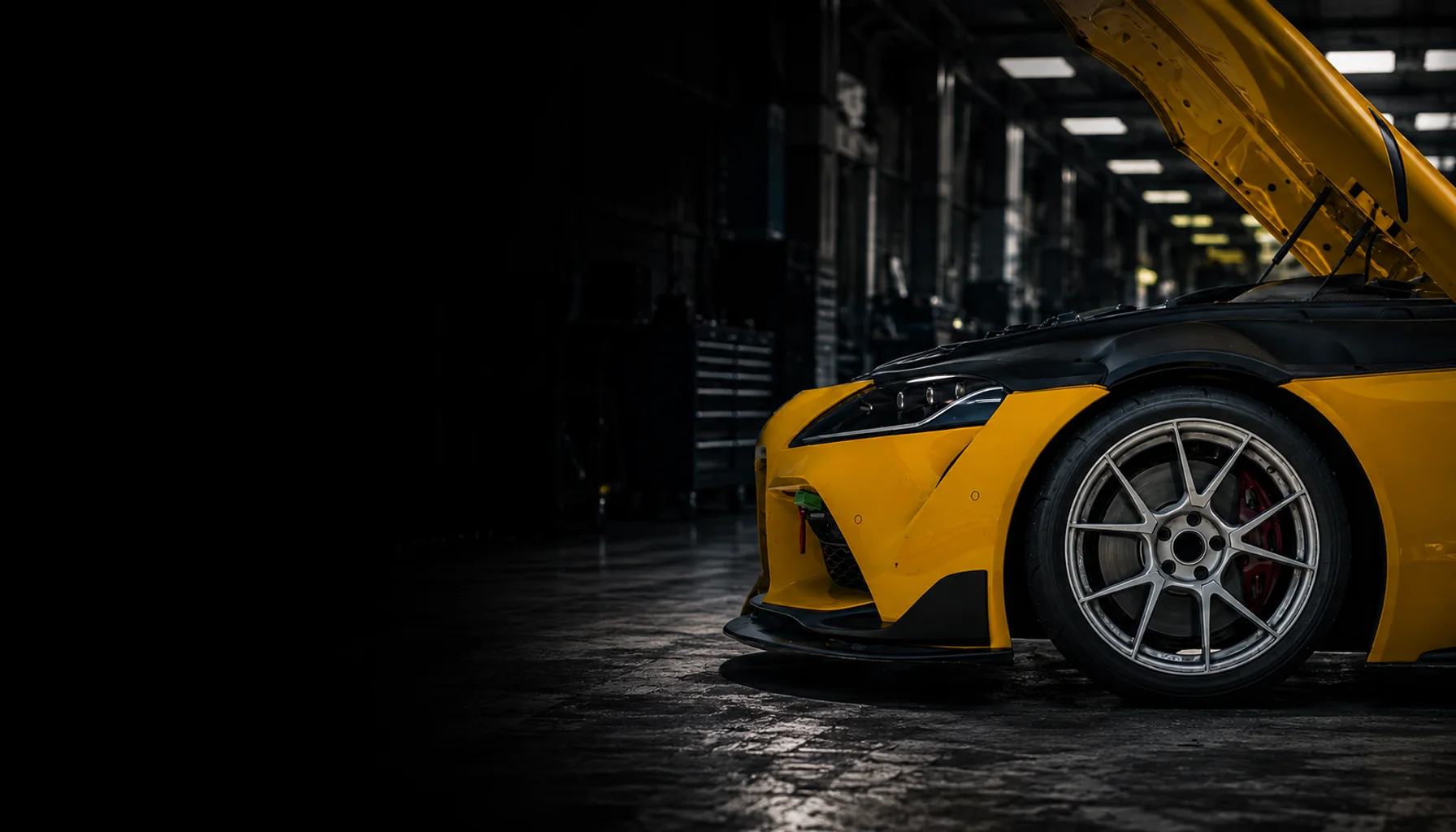 Yellow performance car in a workshop